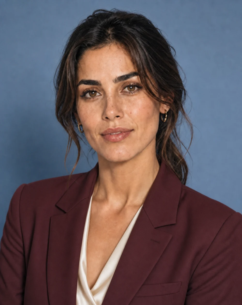 The same woman wearing a burgundy suit after editing her clothes